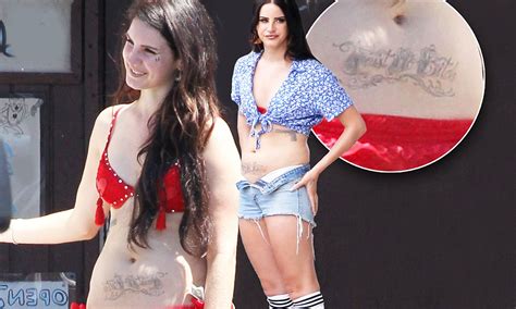 In an interview, lana said about her tattoo that, death and paradise for me are linked. Lana Del Rey reveals large faux belly tattoo as she slips ...