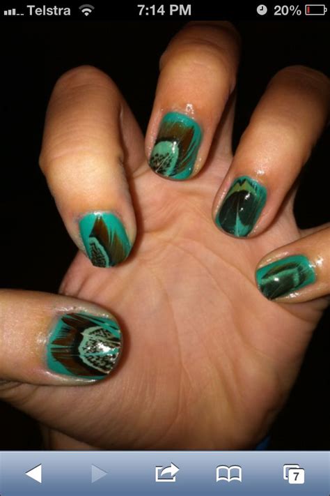 The haircut gets its name because the hair style. Peacock nails | Feather nails, Hair and nails, Peacock ...