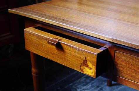 It can be a storage device or even a conversation piece. A 'human' sized walnut coffee table. Drawer detail ...