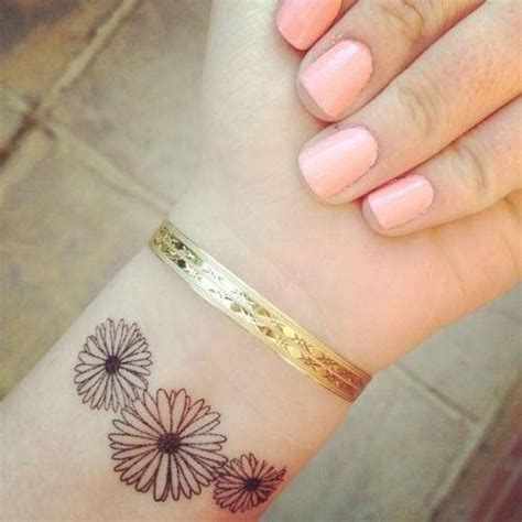 An inner arm tattoo is a smaller version of a sleeve. 23 Daisy Flowers Wrist Tattoos