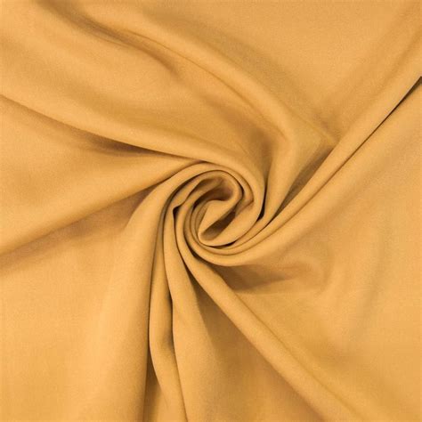 The suspected origins of this fabric are quite interesting. Tissu viscose twill ocre