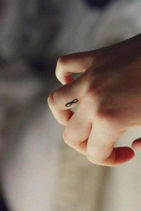 Infinity with symbol of heart or love. finger tattoo | Tattoos, Infinity tattoos, Finger tattoos