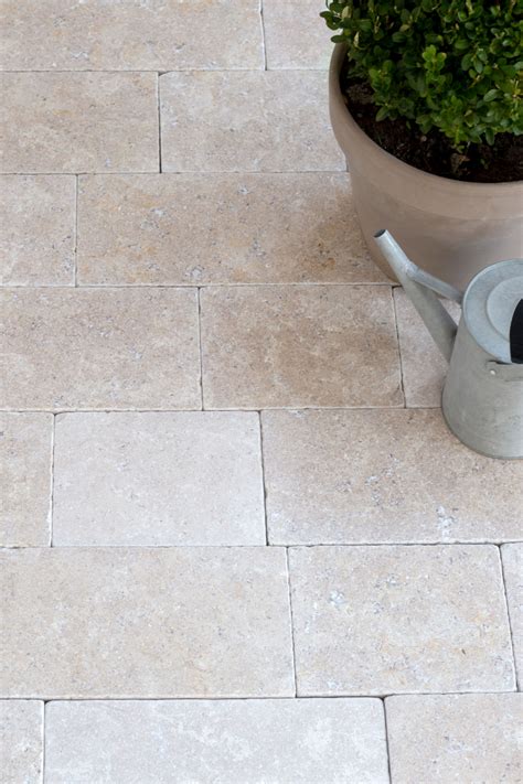 The beautiful soft taupe undertones are complemented by the delicate dove grey fossil and mineral detail throughout the stone. Dijon tumbled limestone cobbles | outdoor limestone ...