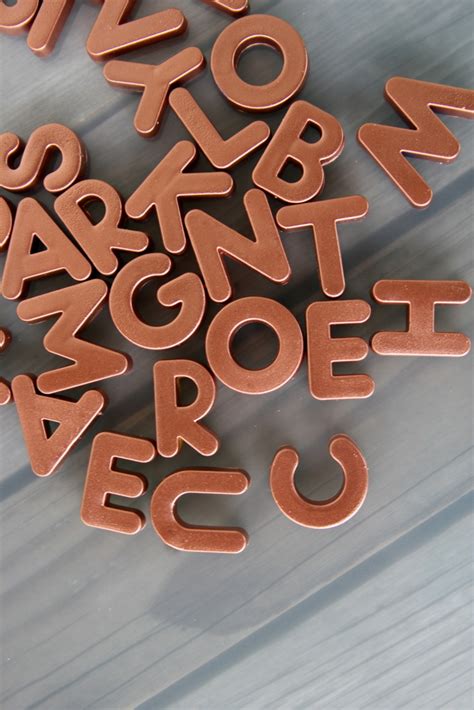 When we first start introducing the letters of the alphabet in our home preschool, we like to print off a few copies of large block letters and find various ways to play with them. DIY metallic alphabet magnets