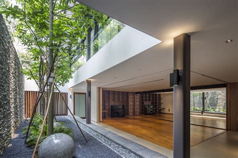 The house has a cube inside in comprised of a garden allowing ample amount of sunlight into the house. Gallery of Secret Garden House / Wallflower Architecture ...