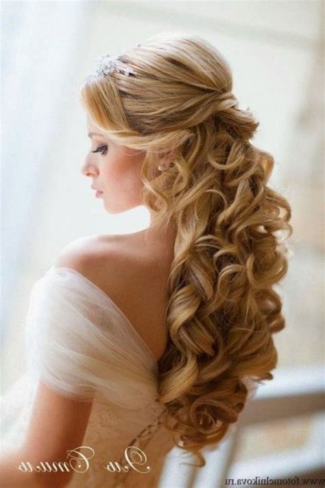 The dress, the caterers, the music, the theme—when planning a wedding, the options are seemingly endless and all equally appealing, which can be totally frustrating for a lot of brides. Half Up Half Down Wedding Hairstyles With Tiara And Veil With Ve… | Long hair wedding styles ...