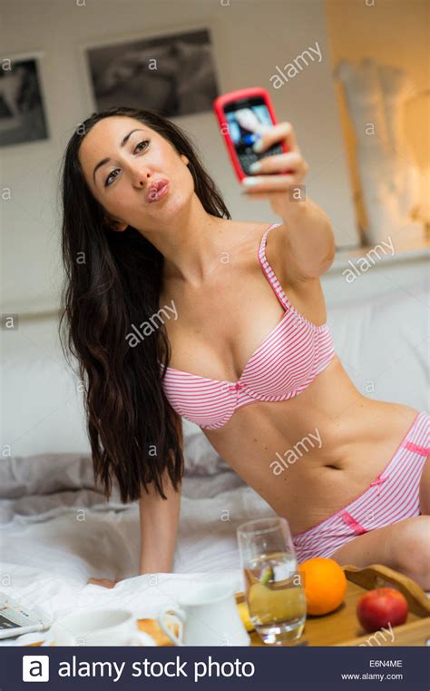 Dreamstime is the world`s largest stock photography community. A pretty young woman girl wearing pink underwear taking a ...