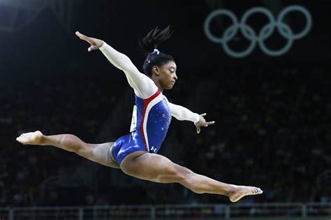 Simone biles blows a kiss to the camera while watching the men's gymnastics competition. Rio 2016: How Simone Biles Crushed the Olympic Competition ...