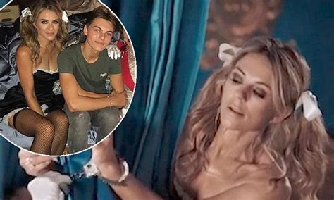 Summer's not over until elizabeth hurley says it is! Elizabeth Hurley bound in handcuffs as a French maid on ...