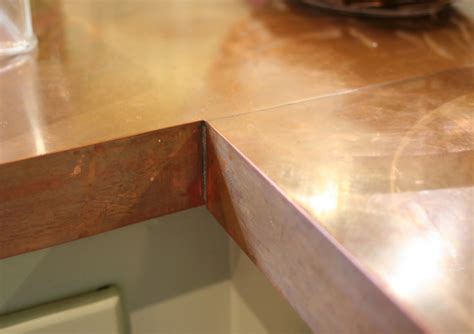 It costs an average of $1.15 per/sf of countertop that is cut, fastened and anchored to the cabinetry. Lilliedale: DIY Copper Countertops