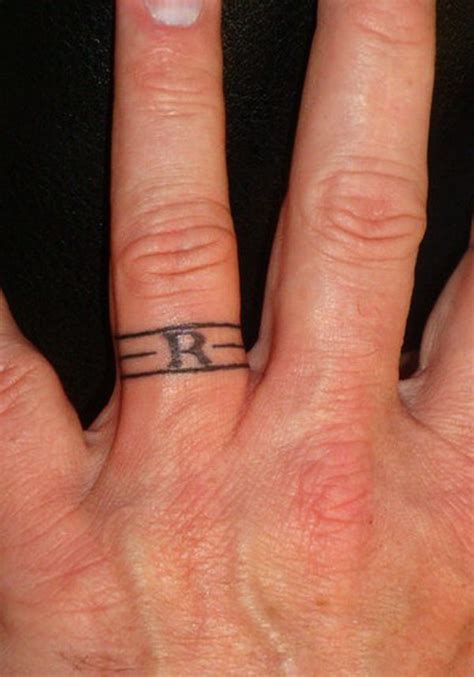 If you're looking for a rad font to go along with your cross tattoo, check our this curated collection: 40+ Sweet & Meaningful Wedding Ring Tattoos | Styletic