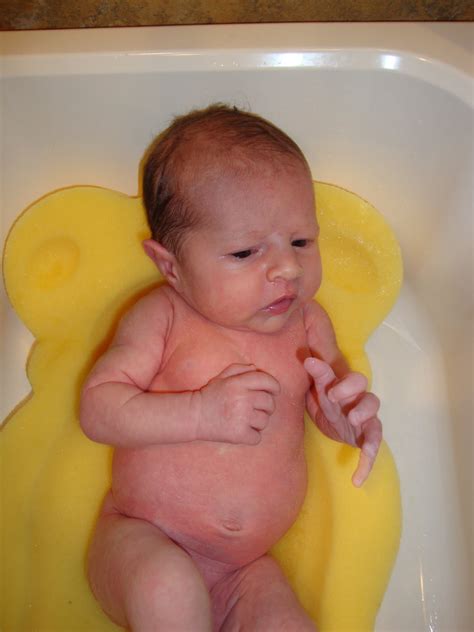 Never leave your baby alone in the bath, not even for a second. Griffin and Grayson's Space: Grayson's First Bath