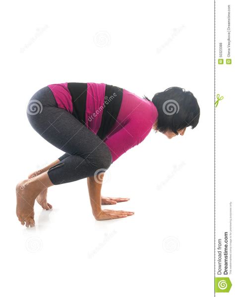 Polish your personal project or design with these bakasana transparent png images, make it even more personalized and more. Mature Woman In Bakasana Yoga Pose Stock Photo - Image of ...