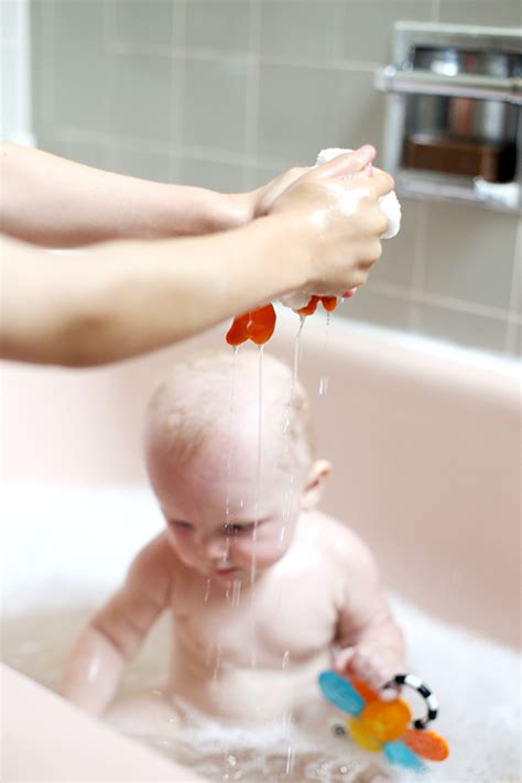 I wipe her with a wet cloth on her face, neck, hands, and feet in between and brush her hair several times a day. Baby Bath Time - Say Yes