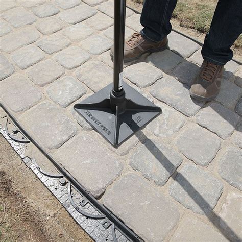 Cheap walkway ideas include wood, stones and gravel. Tamping the Blocks to Settle the Walkway. | Paver walkway ...