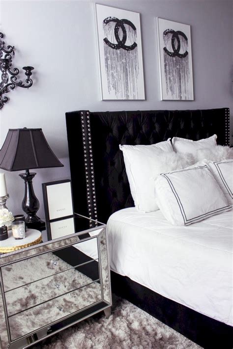 Black walls, a black painting, and a black headboard are contrasted by pops of rich green color and white bedding in this black and white bedroom that follows one of nelson's suggestions for decorating a space with these colors. awesome 59 Amazing Black And White Bedroom Ideas | White ...