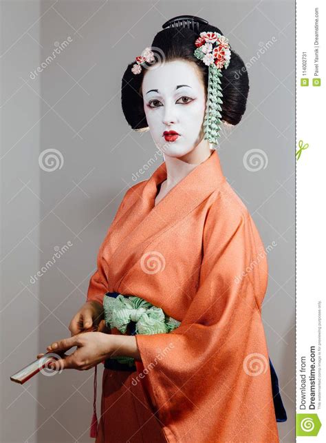 For us westerners, we can learn more about the application and use of this genre of makeup, and discover that it is much more than just a halloween costume. Woman In Geisha Makeup And A Traditional Japanese Kimono ...