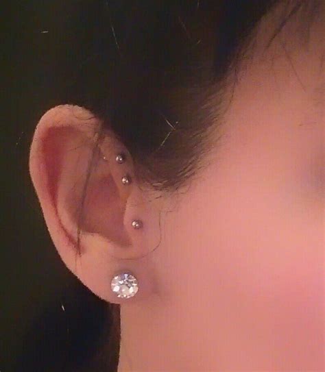 Needles, sharpened bones, or other tools used in play piercing are removed from the body when the episode is complete, allowing the wounds to he Double Anti Helix and Tragus (With images) | Piercings ...