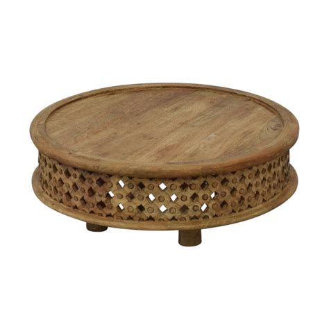 Inspired by a ceremonial african stool, this carved wood ellipse table's intricate texture is hand hewn by artisans in jaipur, india, from solid mango wood. 18% OFF - West Elm West Elm Carved Wood Coffee Table / Tables