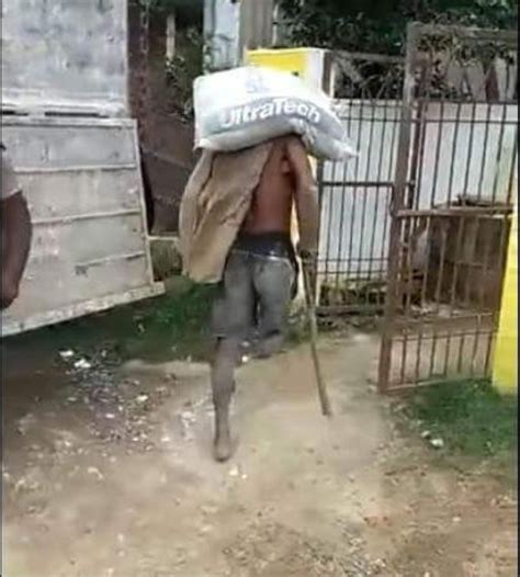 It turns out he just wanted to check his balance. One Legged Man Carrying Cement Bag (Photos) - Career - Nigeria