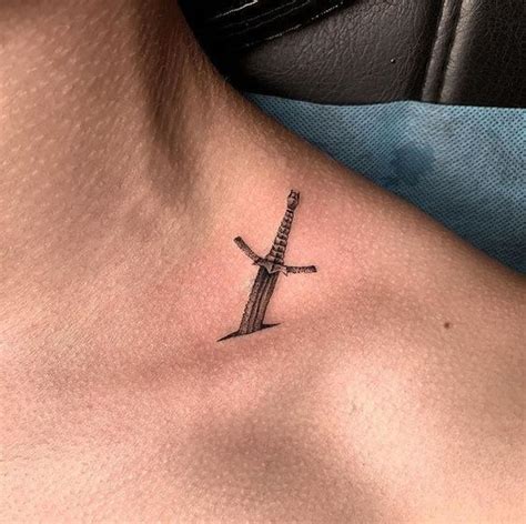 Its going all 100% on the bone. Sword tattoo on the collar bone | www.otziapp.com | Sword ...