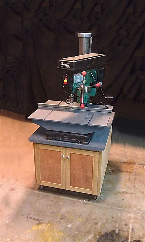 If i do ever need to lower the drill press table, all i have to do is slide the cabinet out of the way and slide it back in place when i am done. Cabinet for Grizzly radial drill press. | Woodworking shop ...