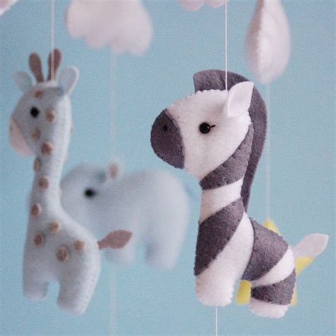 I actually purchased patterns to make these animals off of etsy. Baby mobile boy animals nursery mobile felt Africa safari ...