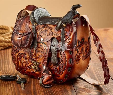 Saddlemen's saddlebags are designed for maximum storage and quality and sportbike panniers. Tooled Leather Saddle Handbag | Wild Wings | Saddle ...