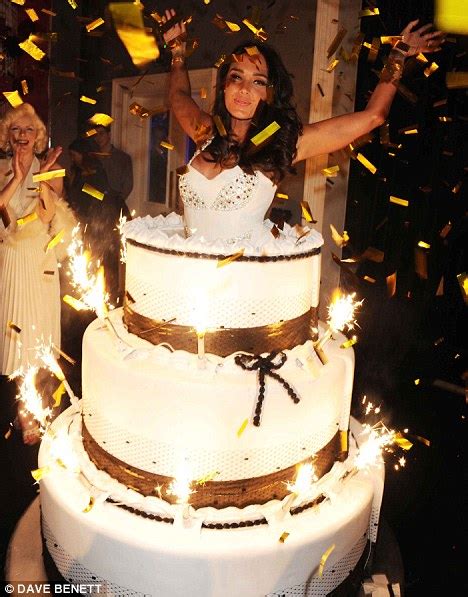 She takes the surprise out of cakes, and the cakes out of her butt. Tamara Ecclestone jumps out of a giant cake at her ...