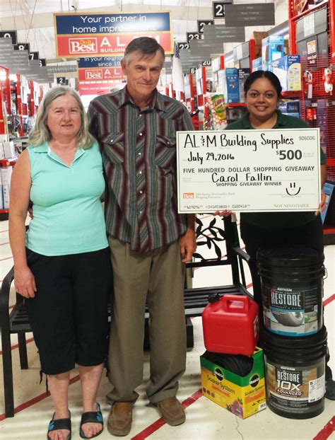 (palm leaves faded in background with a yellow square with black writing that reads: AL&M Building Supply hands out bi-annual awards | The ...