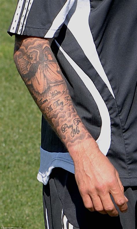 A haloed christ seated on the. 25 David Beckham Tattoos With Meaning And Pictures