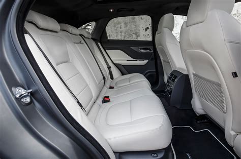 Full floor console w/covered storage and mini overhead console w/storage. 2017-Jaguar-F-Pace-First-Edition-interior-rear-seat.jpg ...