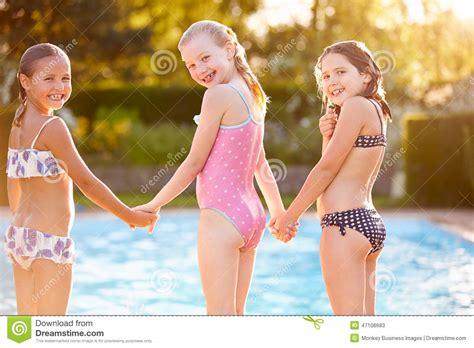 Four in a row is an activity for groups of three students. Group Of Girls Playing In Outdoor Swimming Pool Stock ...
