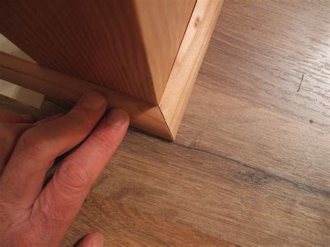 Attach the upper cabinets to the wall the kitchen installers begin by using a level to mark the locations of the wall and base cabinets (image 1). How to Install Shoe Molding or Quarter-Round