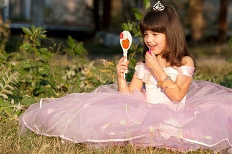 Die dicke sohle aus gummi gibt deinem style das gewisse etwas und dämpft außerdem jeden deiner schritte. Cute small princess enjoys herself | Stock Photo | Colourbox