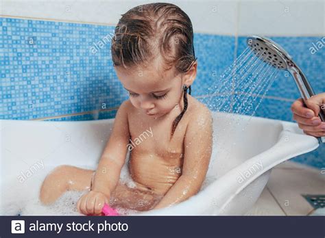 If you give birth in a hospital, nurses will probably bathe your baby within a few hours of delivery. Beautiful little girl taking a bath at home. A cute baby ...