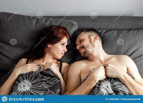Young Lovely Couple Lying In A Bed, Happy Smile Love Looking To Each Other, Top Above View, Hold ...