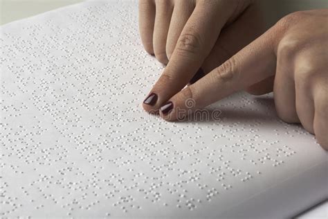 The braille code is physically presented as raised dots. Blind Reading Text In Braille Language Stock Image - Image ...