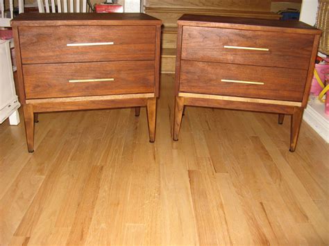 With a stained finish, featuring angled legs and a unique cutout. Beautiful mid century modern nightstands by Dixie ...