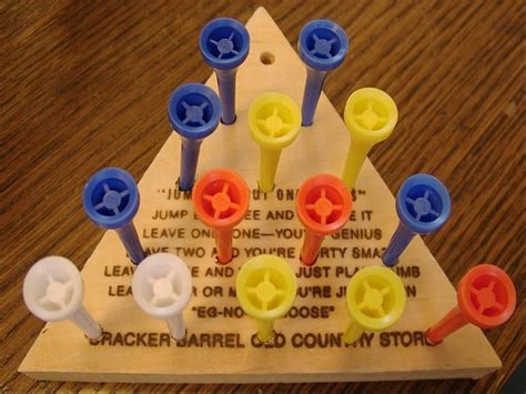 This movie explains how to solve the peg game and remember the solution. Cracker Barrel Triangle w/Golf Tees Game : nostalgia