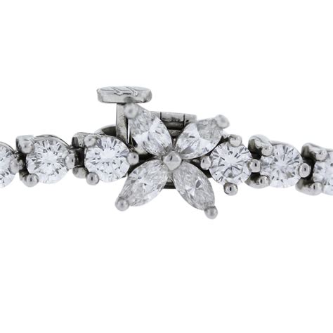 This lovely platinum tennis bracelet features 20 sparkling round brilliant diamonds alternating with 40 straight baguettes in a unique twist on a classic piece of jewelry. Tiffany & Co. Victoria Line Platinum & Diamond Tennis Bracelet