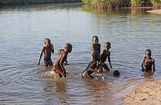 african boys river gambia playing distributary