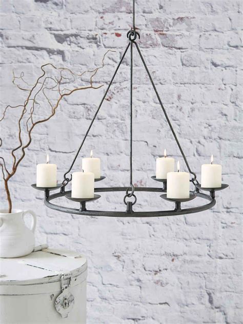 We offer chandelier lighting and installation services. Wrought Iron Candle Chandelier | Wrought iron candle ...