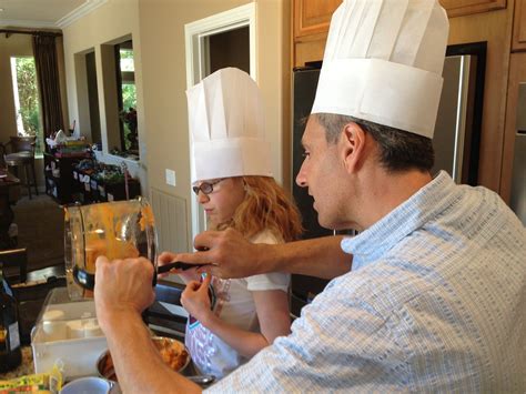 A father and daughter cooking class Cooking together gives ...