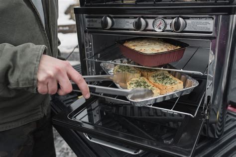 A camping oven that you use on top of your camping stove can give you more cooking options while camping. Outdoor Oven | Camping oven, Outdoor oven, Diy camping