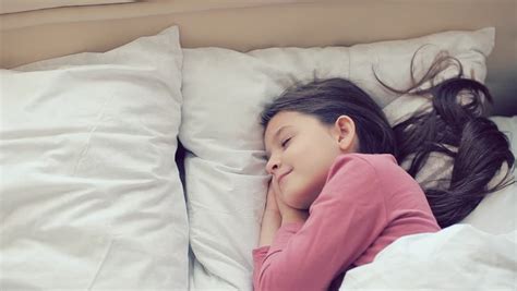 Waking up beautiful has been her private practice since 2002. Cute Girl Sleeping On Stomach Waking Up And Yawning Stock ...
