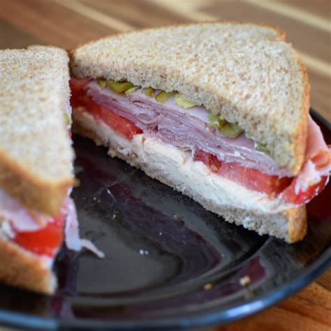 A hot alternative to the usual lunch or snack. Creamy Swiss, plum tomato, honey ham, and homemade picked ...