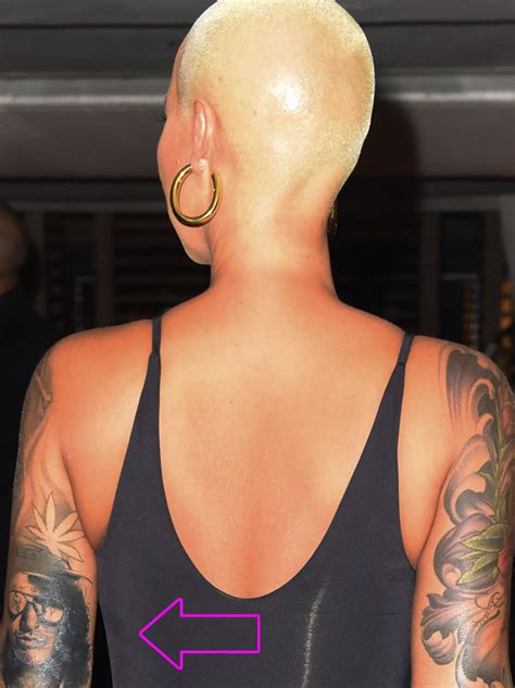 Rose's tattoo now depicts a man that. Amber Rose Covers Wiz Khalifa Tat with Slash Portrait ...