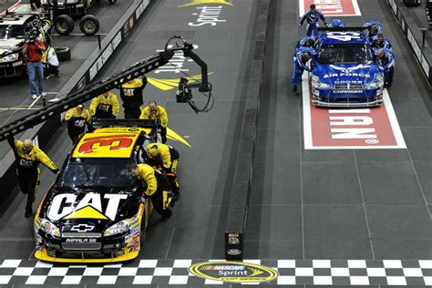 — repairing damaged vehicles during a nascar race sometimes is as common a sight as… Jeff Burton and crew chief Scott Miller get a leg up on ...