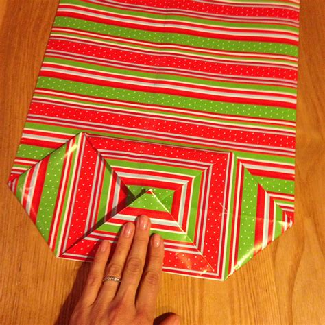 Medium weight wrapping paper is ideal because it's sturdy, but these gift bags are not recommended for items that are extremely tall and/or heavy. How to make a gift bag out of wrapping paper! — Happy ...